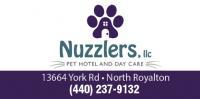 Nuzzlers Pet Hotel and Daycare logo