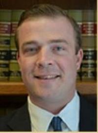 Law Office of John R. Kominski, Jr., LLC Logo