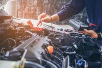 Ruben's Transmission & Auto Care Logo