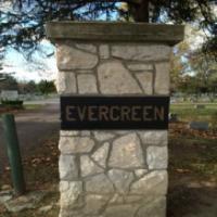 Evergreen Cemetery - Evergreen Monuments Logo