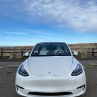 Carlie’s Tesla Logo