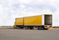 Heavy WheelsTrucking Inc Logo