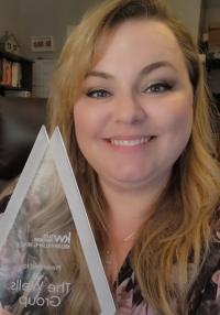 Michele Wells -The Wells Group at People's Trust Realty Logo