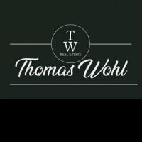 Thomas Wohl Real Estate - eXp realty Logo