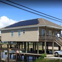 Solar Solutions/Richmond's Heating & Cooling LLC Logo