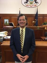 John M. Silvestri, Esq. Logo