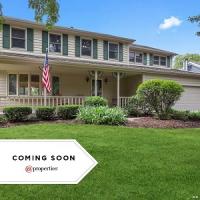 Sue Dunnigan @properties Real Estate Agent Logo