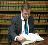 Michael D. Curran, Attorney at Law Logo